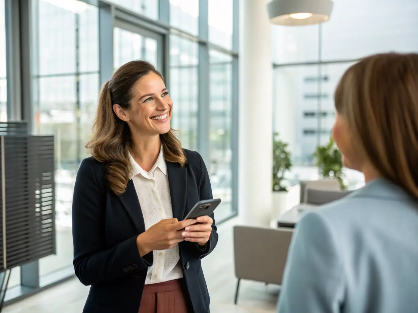 An employee sending a business SMS message using the Intermedia Unite mobile app on a smartphone, highlighting the convenience and efficiency of mobile communication.