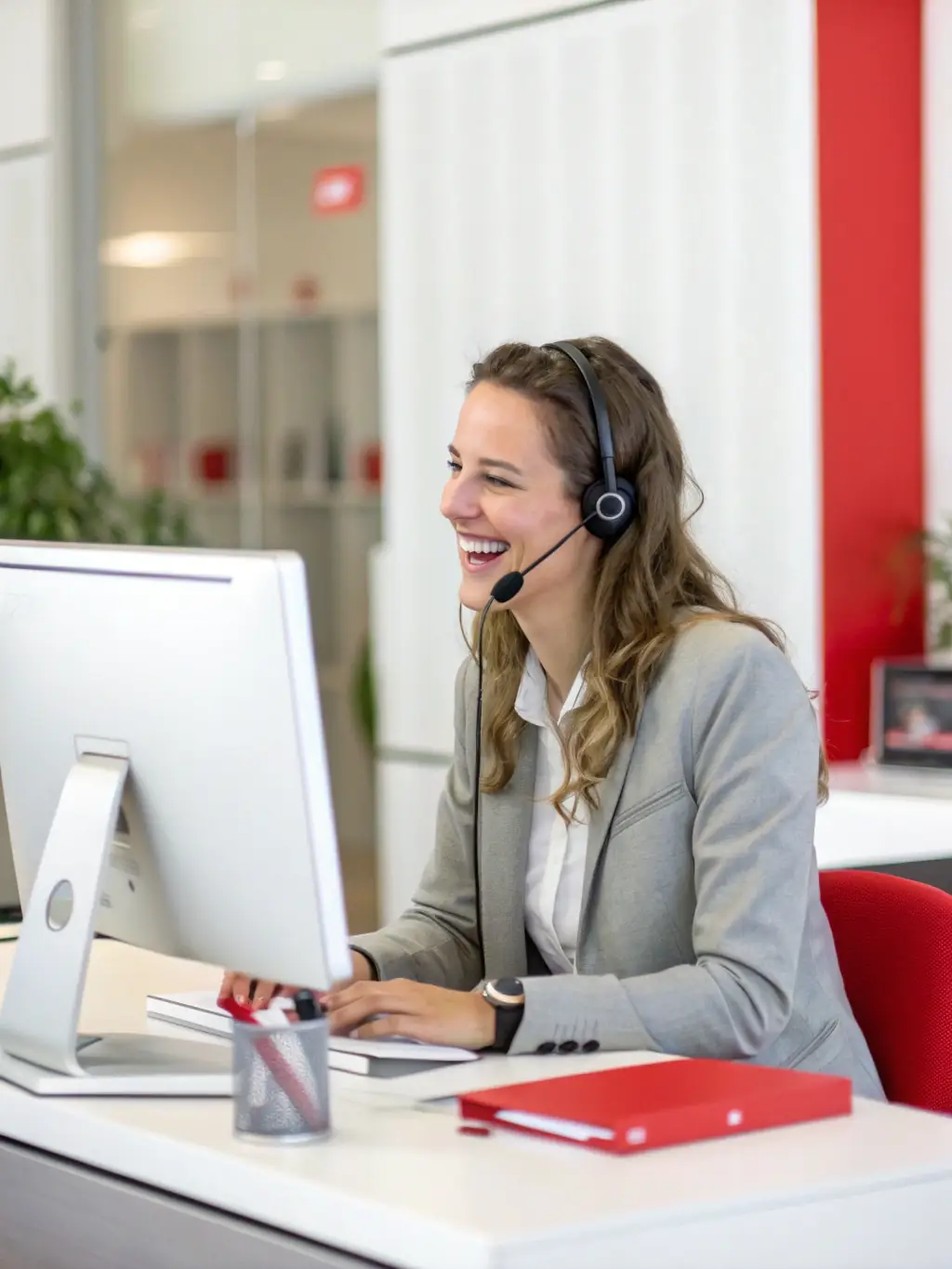 A professional automotive dealership employee answering a call with a headset, showcasing clear communication.