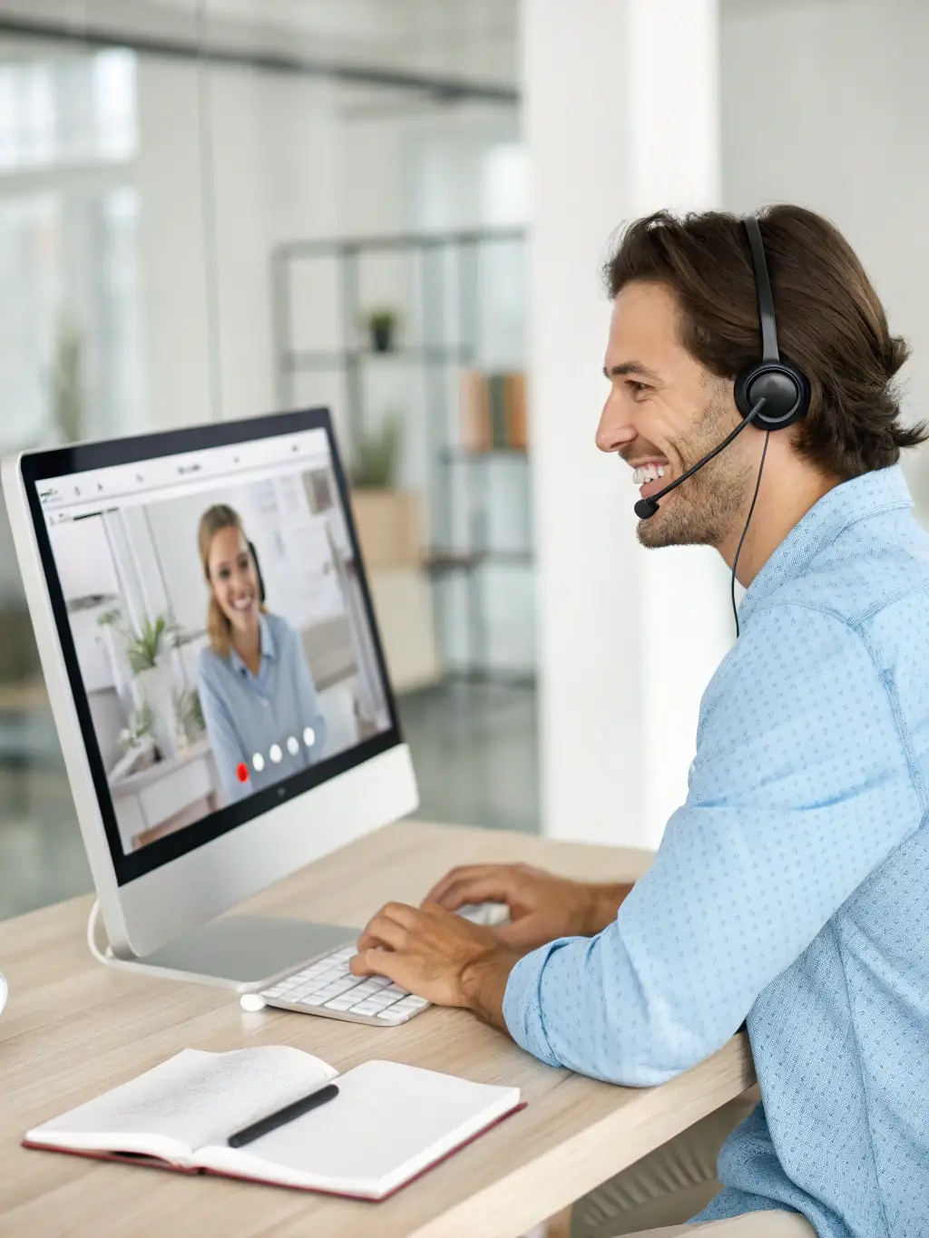 A support team member assisting a client remotely with their VoIP system, showcasing DataTel 360's ongoing support services.