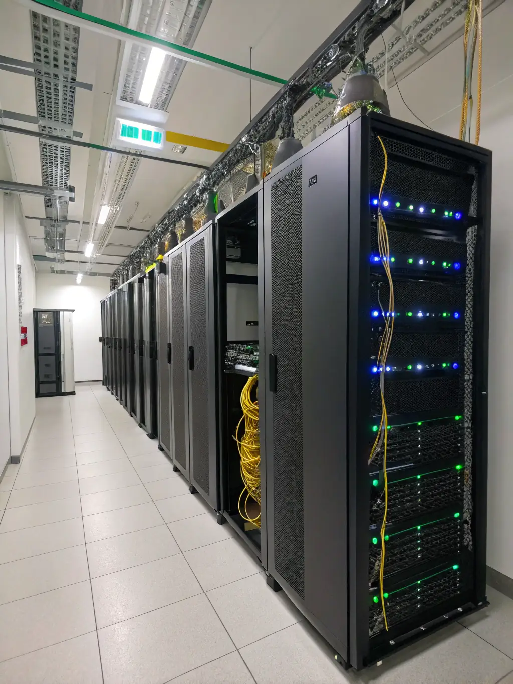 A well-organized IDF/MDF room with clearly labeled patch panels, switches, and other network equipment. The image showcases a clean and efficient network setup.