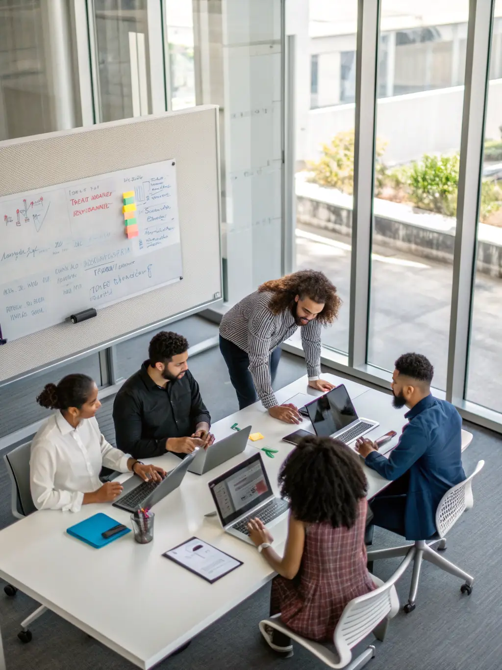 An image depicting a diverse team of IT professionals collaborating on a network design, showcasing DataTel 360's design-first approach. The image should convey innovation and expertise.