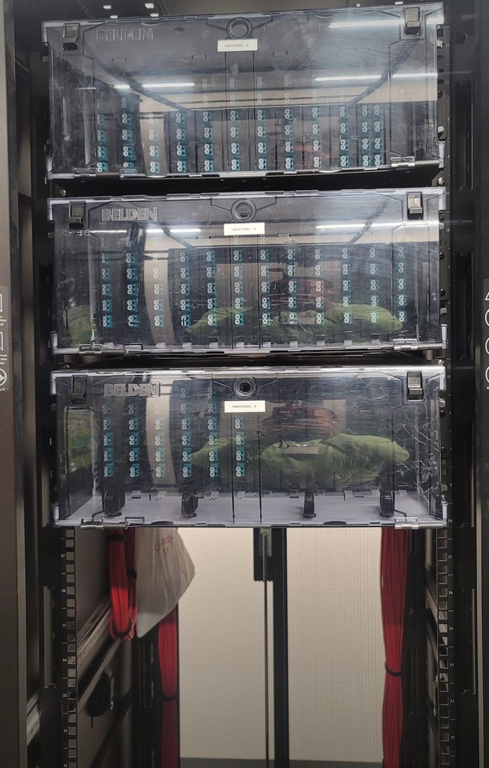Three rack-mounted fiber optic patch panels labeled Fiber Panel A, B and C, loaded with LC fiber adapters, installed by DataTel 360 in Georgia