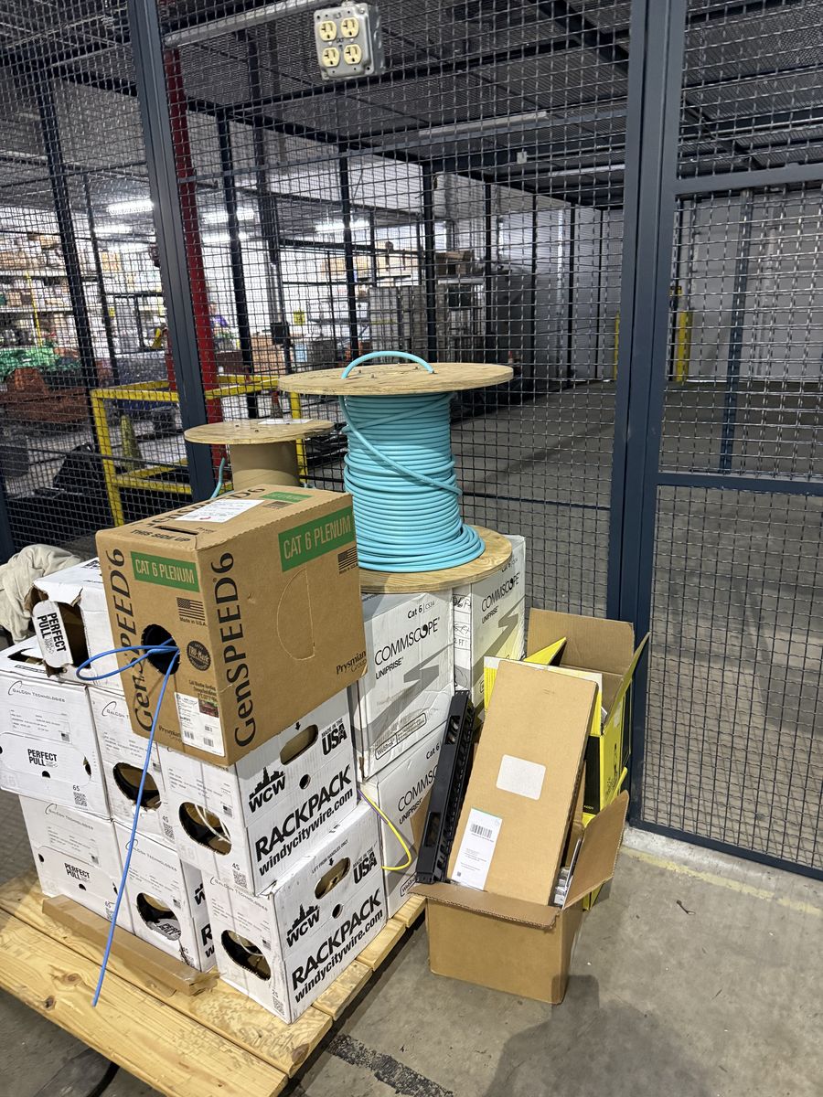 Pallet of network cabling staged for installation inside a United States Postal Service sorting facility in Atlanta, Georgia